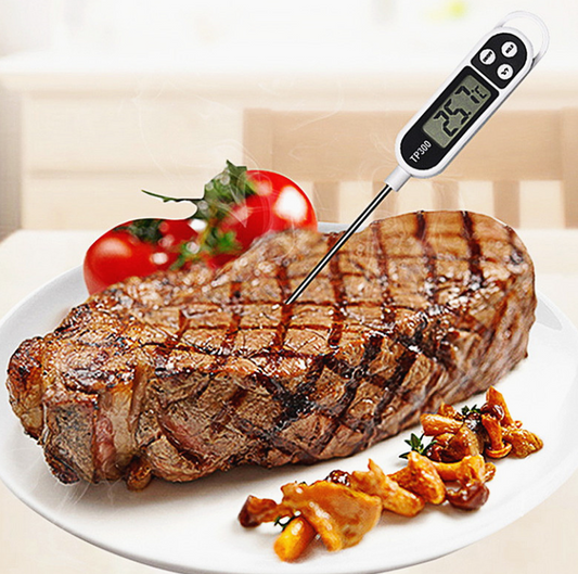 instant read digital meat thermometer with stainless steel probe
digital cooking thermometer reading temperature on a grill
candy and deep-fry thermometer measuring hot oil